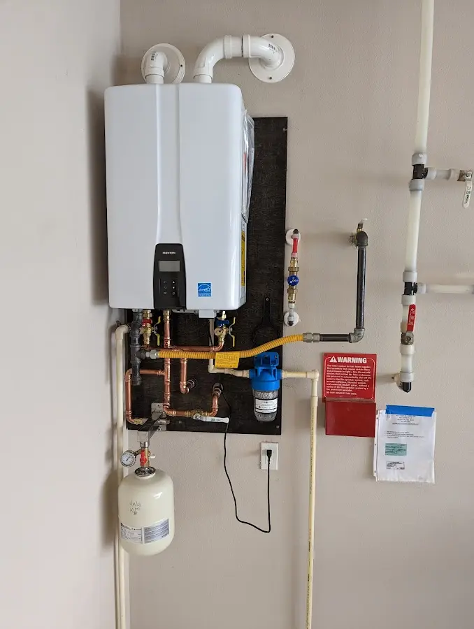 Professional plumber installing copper piping in a The Dalles home